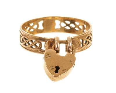 Lot 514 - Unusual vintage gold 'padlock' ring with a Celtic design pieced gold band, secured by a detachable gold padlock, ring size N½.