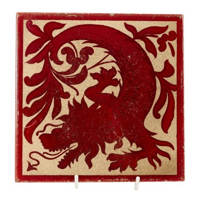 Lot 282 - Craven Dunnill & Co Copper Lustre tile designed by Lewis F. Day, depicting a dragon surrounded by foliage.