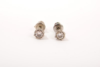 Lot 503 - Pair of diamond single stone stud earrings with an old cut diamond in platinum setting on with white metal post fittings, estimated total diamond weight approximately 0.40cts.