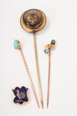 Lot 505 - Three antique stick pins and a stud, to include a Victorian fox head stick pin, two Victorian turquoise stick pins and a French gold and enamel stud with cockerel design (4)