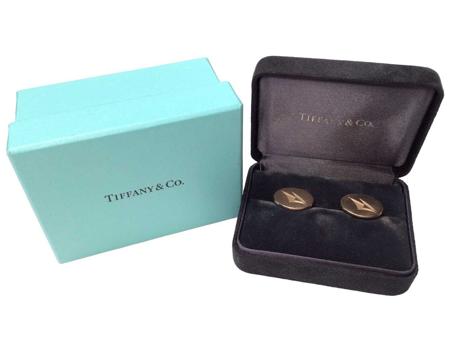 Lot 356 - Pair of Tiffany & Co. 14ct gold cufflinks with stylized yachts/sails, in Tiffany boxes.