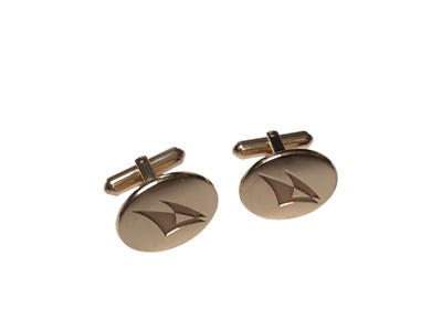 Lot 356 - Pair of Tiffany & Co. 14ct gold cufflinks with stylized yachts/sails, in Tiffany boxes.