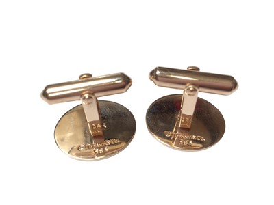 Lot 356 - Pair of Tiffany & Co. 14ct gold cufflinks with stylized yachts/sails, in Tiffany boxes.