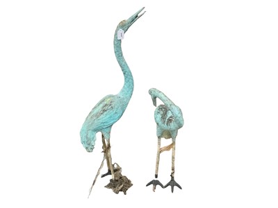 Lot 2669 - Pair of freestanding metal garden ornaments in the form of storks, 104 and 75cm in height, (2).