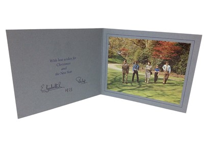 Lot 43 - H.M.Queen Elizabeth II and H.R.H. The Duke of Edinburgh, signed 1973 Christmas card with twin gilt embossed Royal Cyphers to cover, colour photograph of The Royal Family in a garden, signed in ink...