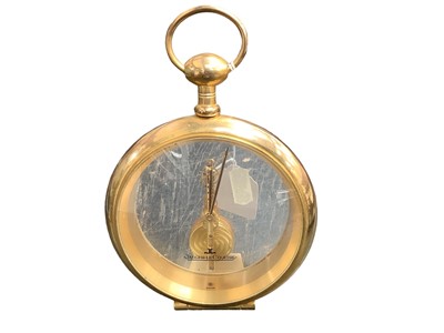 Lot 2447 - Jaeger Le Coultre brass and glass cased desk clock in the form of an oversized pocket watch