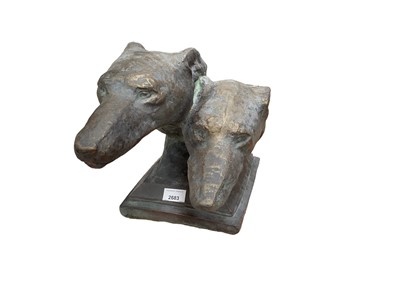 Lot 2683 - Bronzed terracotta sculpture in the form of two greyhound heads, 47cm long