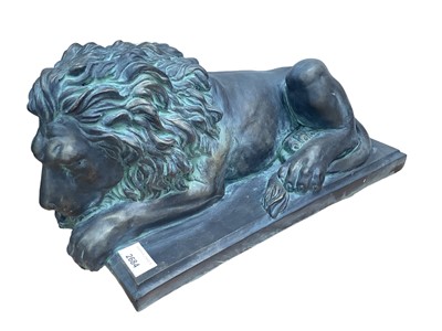 Lot 2684 - Bronzed terracotta sculpture in the form of a recumbent lion, 39.5cm long