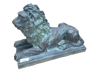 Lot 2685 - Bronzed terracotta sculpture in the form of a recumbent lion, 37cm long