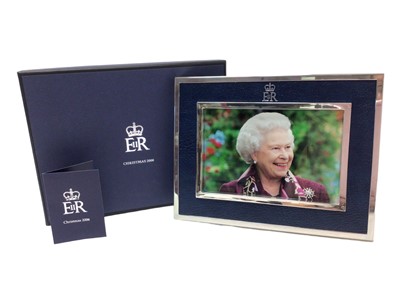 Lot 59 - H.M.Queen Elizabeth II, 2006 Royal Household Christmas gift, silver plated and leather photograph frame with crowned ERII cypher and containing a charming photograph of The Late Queen, in original...