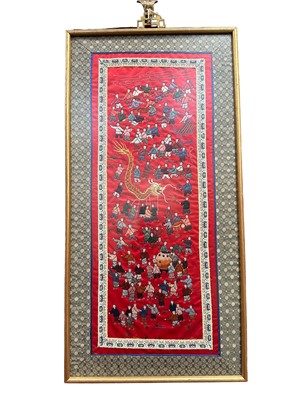 Lot 488 - Chinese embroided silk panel depicting children playing, on vibrant red ground, in glazed gilt frame