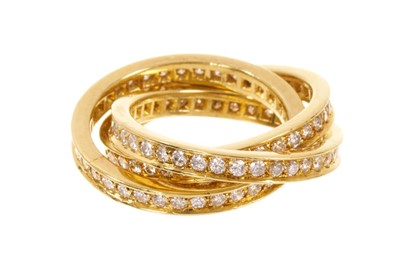 Lot 565 - Diamond triple band eternity ring, the Russian-style interlocking bands with brilliant cut diamonds in 18ct yellow gold setting. Ring size approximately I-J.