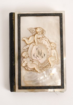 Lot 773 - 19th century French relief carved mother of pearl mounted notebook, carved with putti, the silk lined interior with fitted gilt cased pencil, 10cm high