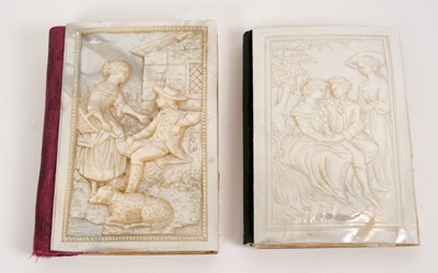 Lot 692 - Two similar 19th century French relief carved mother of pearl mounted notebooks