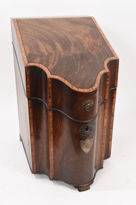 Lot 752 - George III mahogany and tulipwood crossbanded serpentine knife box, with silvered mounts, on ogee bracket feet, interior now vacant, 49cm high