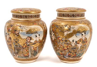 Lot 76 - Pair of Japanese Satsuma ovoid jars and covers, Meiji period, decorated with figures, 13.5cm high