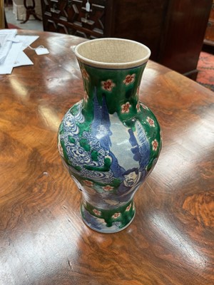 Lot 260 - Near pair of Chinese crackle glaze vases, decorated in underglaze blue with figures on a green and iron red ground, Kangxi marks but later, 18cm and 19cm high