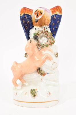 Lot 115 - Staffordshire pottery group of an eagle and a dog, circa 1850