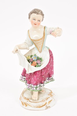 Lot 287 - Meissen figure of a young girl with flowers in her apron, circa 1880