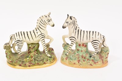 Lot 279 - Pair of Staffordshire pottery zebras