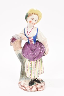 Lot 302 - Faience figure of a young girl