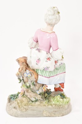 Lot 23 - Continental porcelain figure of a girl with flowers, circa 1890