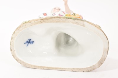 Lot 23 - Continental porcelain figure of a girl with flowers, circa 1890