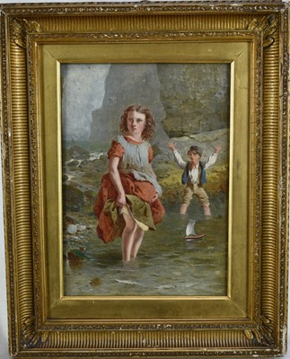 Lot 1032 - English School, mid 19th century, oil on canvas - Children playing with a toy boat in the shallows by cliffs, 25cm x 17cm, in gilt frame