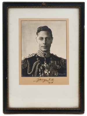 Lot 101 - T.M.King George VI and Queen Elizabeth, fine pair signed Royal presentation portrait photographs taken by Dorothy Wilding, His Majesty wearing his Naval uniform with Orders and Decorations, Her Maj...
