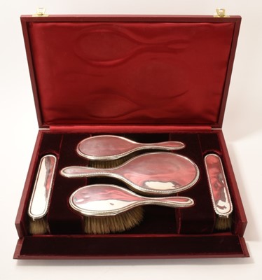 Lot 223 - Silver dressing table set in fitted red leather case