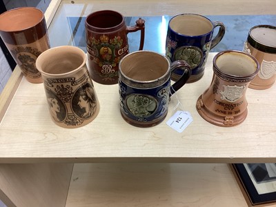 Lot 124 - Collection of seven late 19th/early 20th century Royal Doulton stoneware Royal Commemorative mugs and vessels including silver mounted mug (7)