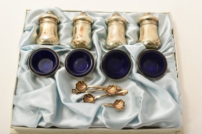 Lot 374 - Boxed set of four pairs American sterling silver salts and peppers with matching spoons.