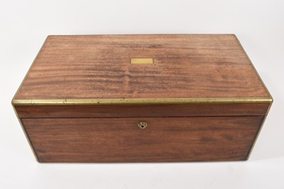 Lot 825 - Large mid 19th century mahogany and brass bound campaign type travelling box, with Bramah lock and flush carrying handles, the fall-front enclosing divisions, 52cm wide