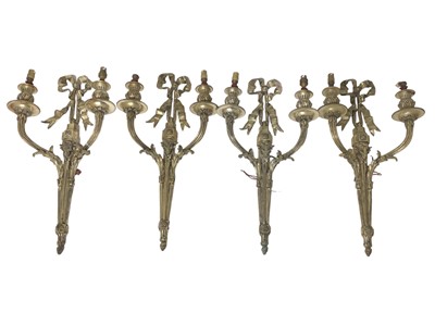 Lot 836 - Set of four silvered three branch wall lights, each with ribbon cresting, 55cm high