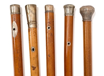 Lot 838 - Four Georgian malacca and silver mounted walking sticks, and another similar the longest 97cm. (5)