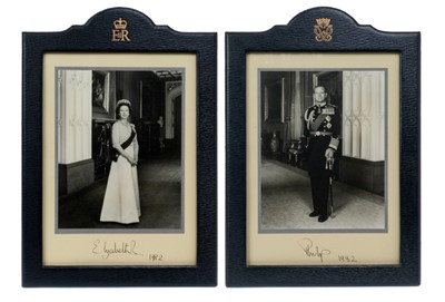 Lot 132 - H.M.Queen Elizabeth II and H.R.H.The Duke of Edinburgh, fine pair signed Royal presentation portrait photographs of the Royal couple taken at Windsor Castle both signed in ink ' Elizabeth R 1982' '...