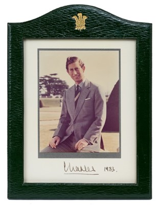 Lot 133 - H.R.H.Prince Charles The Prince of Wales (now H.M. King Charles III), fine signed Royal presentation portrait photograph of the Prince signed in ink 'Charles 1983' in original green Morocco leath...