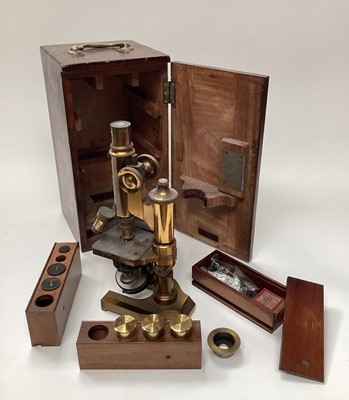 Lot 2604 - Late 19th / early 20th century brass microscope