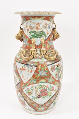 Lot 304 - 19th century Chinese porcelain baluster vase, decorated in the Canton style with fan-shaped panels on a floral ground, 35cm high