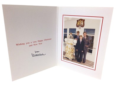 Lot 153 - H.R.H.Prince Charles The Prince of Wales ( now H.M.King Charles III)  signed 1997 Christmas card with gilt embossed P.O.W. Feather crest to cover, colour photograph of the smiling Prince with his t...