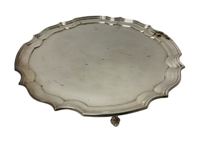 Lot 1644 - Modern silver pie crust salver, raised on scroll feet, Sheffield 1974, 30cm diameter, 24oz