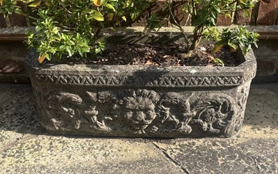 Lot 1235 - Pair of reconstituted garden troughs with mask motifs