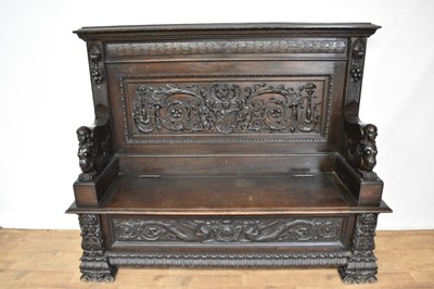 Lot 1101 - 19th century Continental heavily carved oak settle