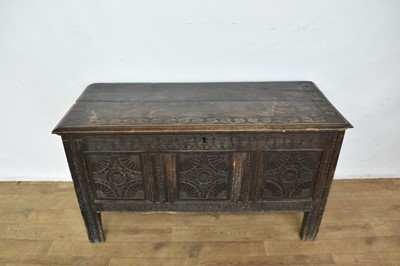 Lot 1104 - 18th century and later carved oak coffer