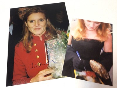Lot 176 - Sarah Duchess of York, signed photograph 20.5 x 15cm sold with photograph of her signing it (2)