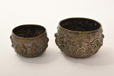 Lot 420 - Two 19th century Burmese silver bowls with repoussé figural decoration, one with peacock marker's mark to the base, 5.5cm x 8cm and 4.5cm x 6.5cm (2)