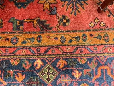 Lot 1290 - Large Ushak style carpet, with vine ornament on brick red ground, 436 x 363