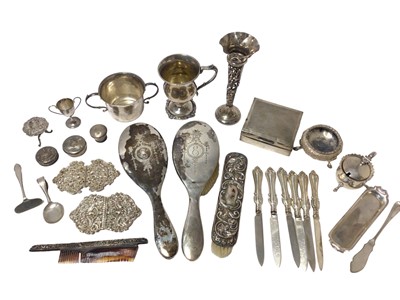 Lot 443 - A collection of silver to include a Victorian salt, mustard pot, miniature tray, christening mug, nurses's buckles etc