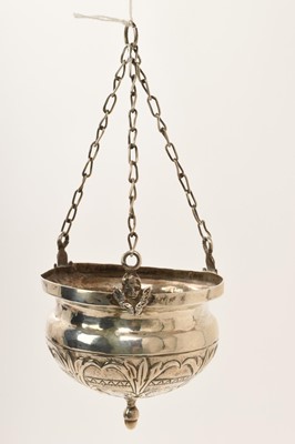 Lot 445 - Antique Continental silver sanctuary lamp, the repoussé bowl suspended from three chains with winged angels, 15cm.