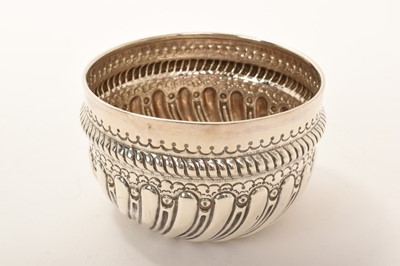 Lot 452 - Late Victorian silver bowl with repoussé spiral reeded and fluted decoration, Birmingham 1889, 9cm diameter x 6cm high, 3oz.